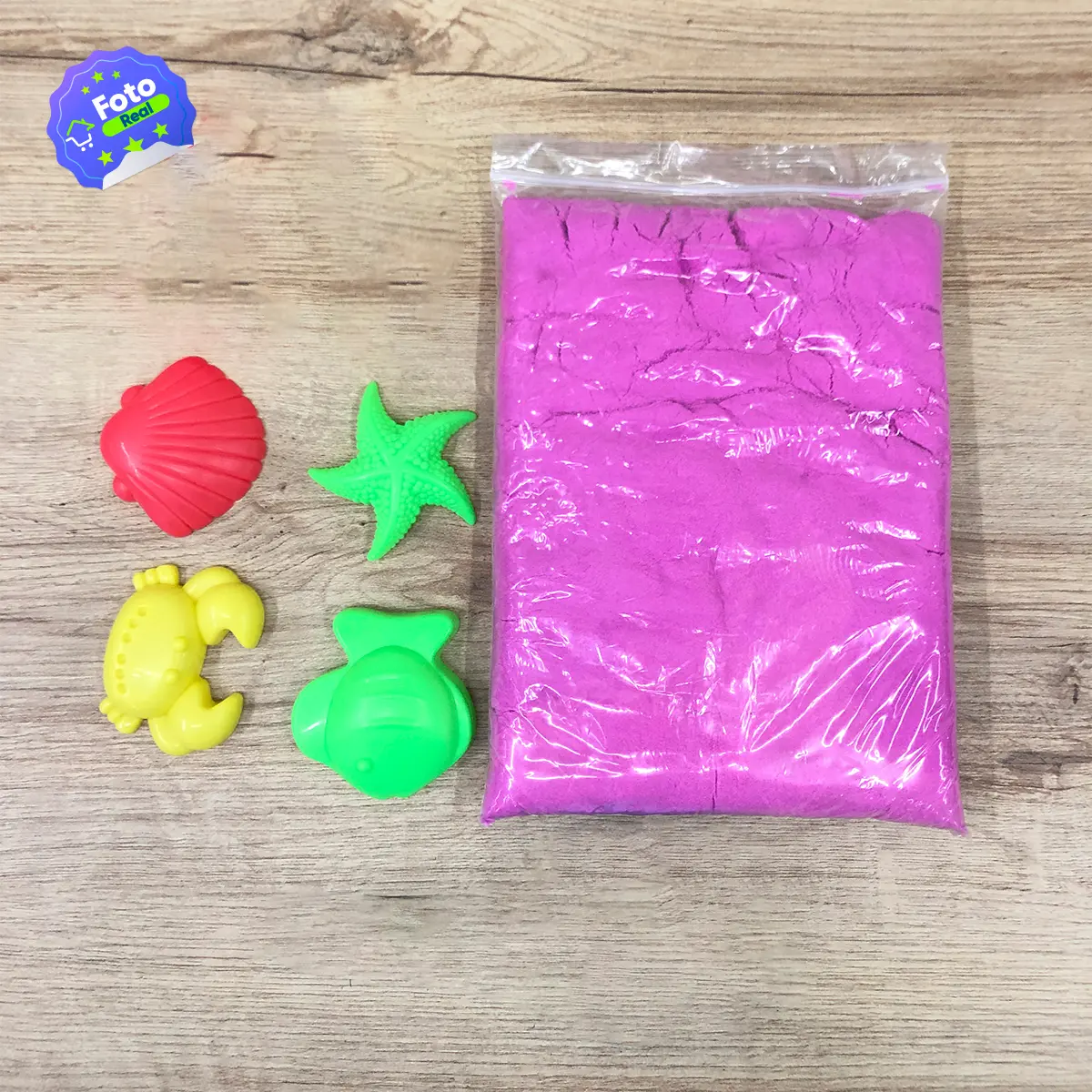 Bolsa de arena cinética rosa con moldes de figuras marinas.