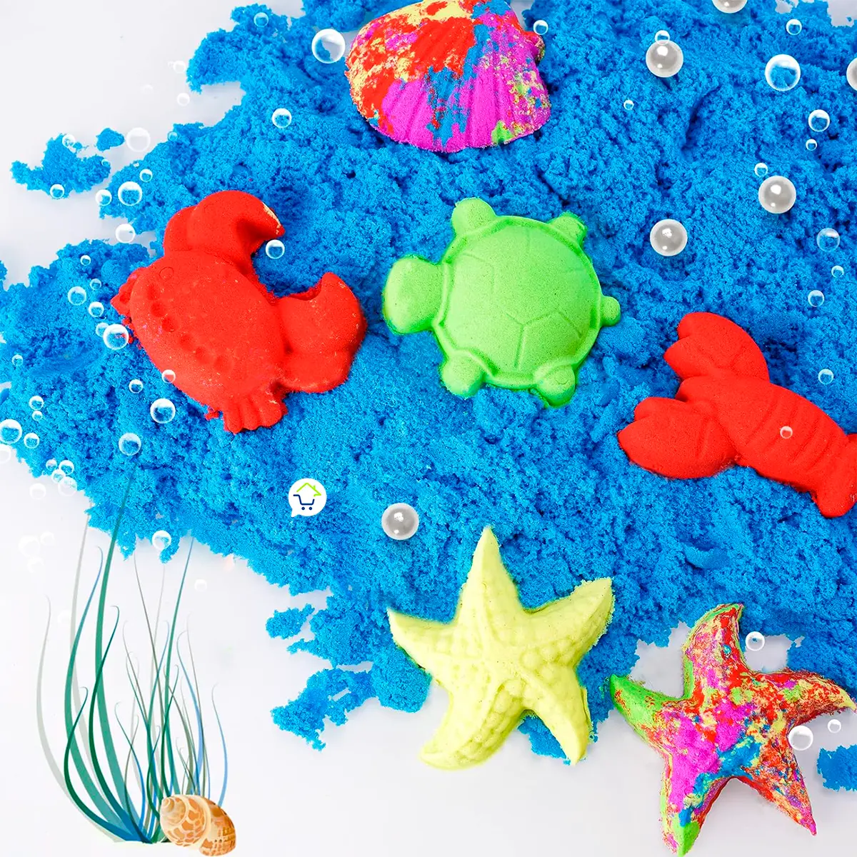 Arena azul con moldes de animales marinos de colores brillantes.
