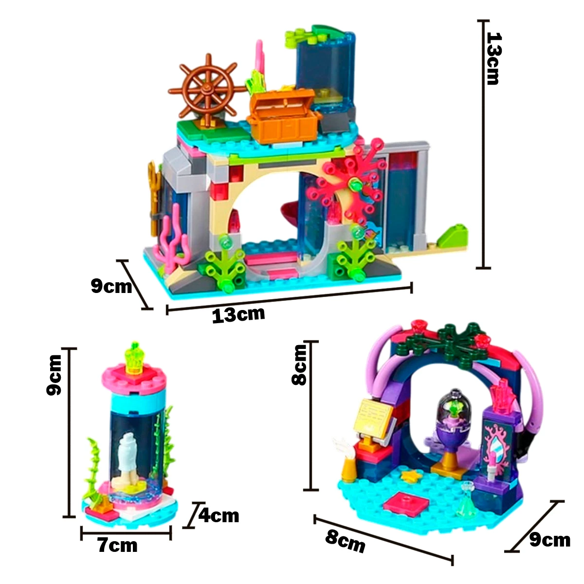 Niña jugando con set de construcción submarino con figuras de sirena y bruja.