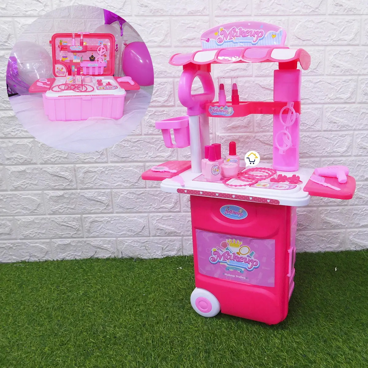 Tocador infantil rosa con accesorios de maquillaje y ruedas.